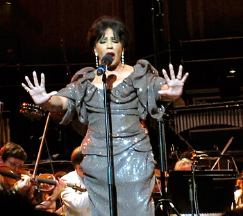 Dame Shirley Bassey sings the theme from <i>Goldfinger</i>.